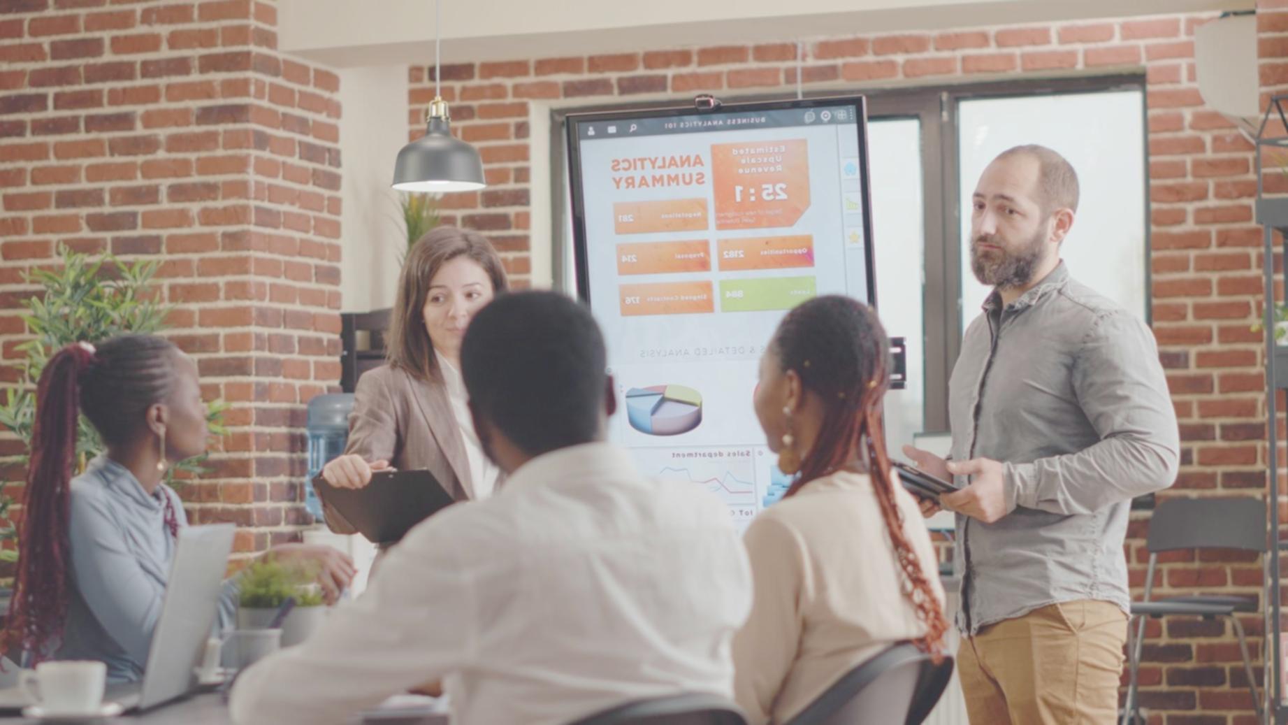 Australian family reviewing budget documents together at kitchen table