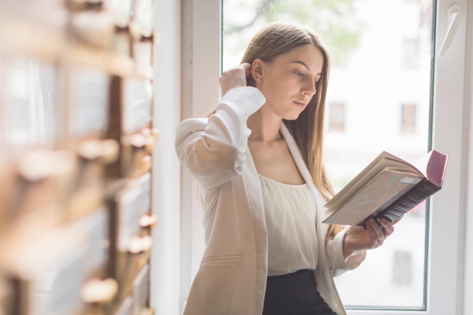 Family budget planning materials spread on wooden desk with calculator and coffee
